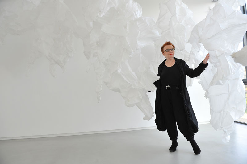 Karin Abt Straubinger in front of a work by Elisabeth Thallauer